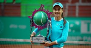 image of a woman winning a tennis championship.