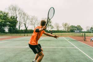 image of a man playing a tennis match